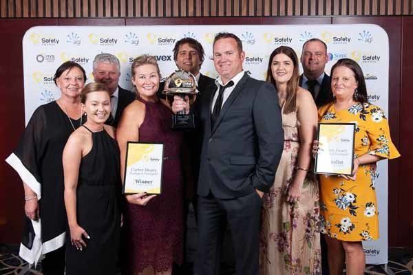 group picture of people holding award