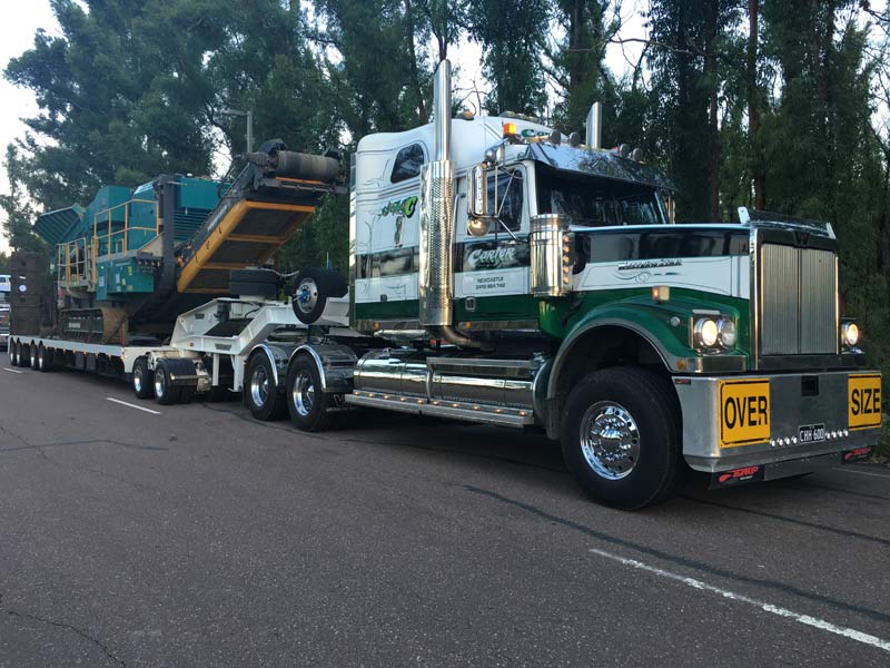green semi truck on road