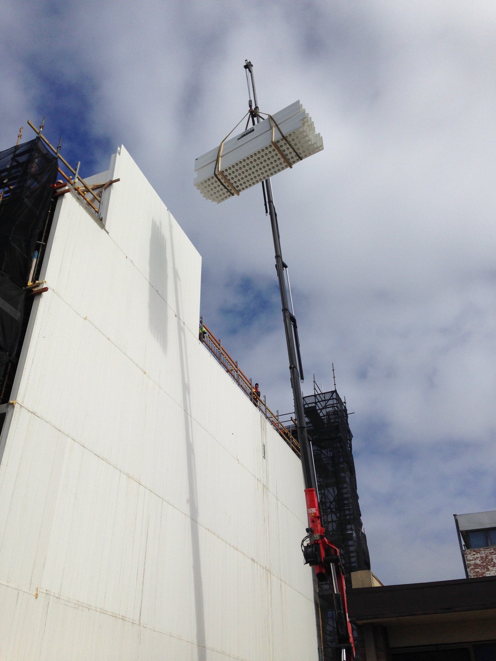 crane lifting concrete materials