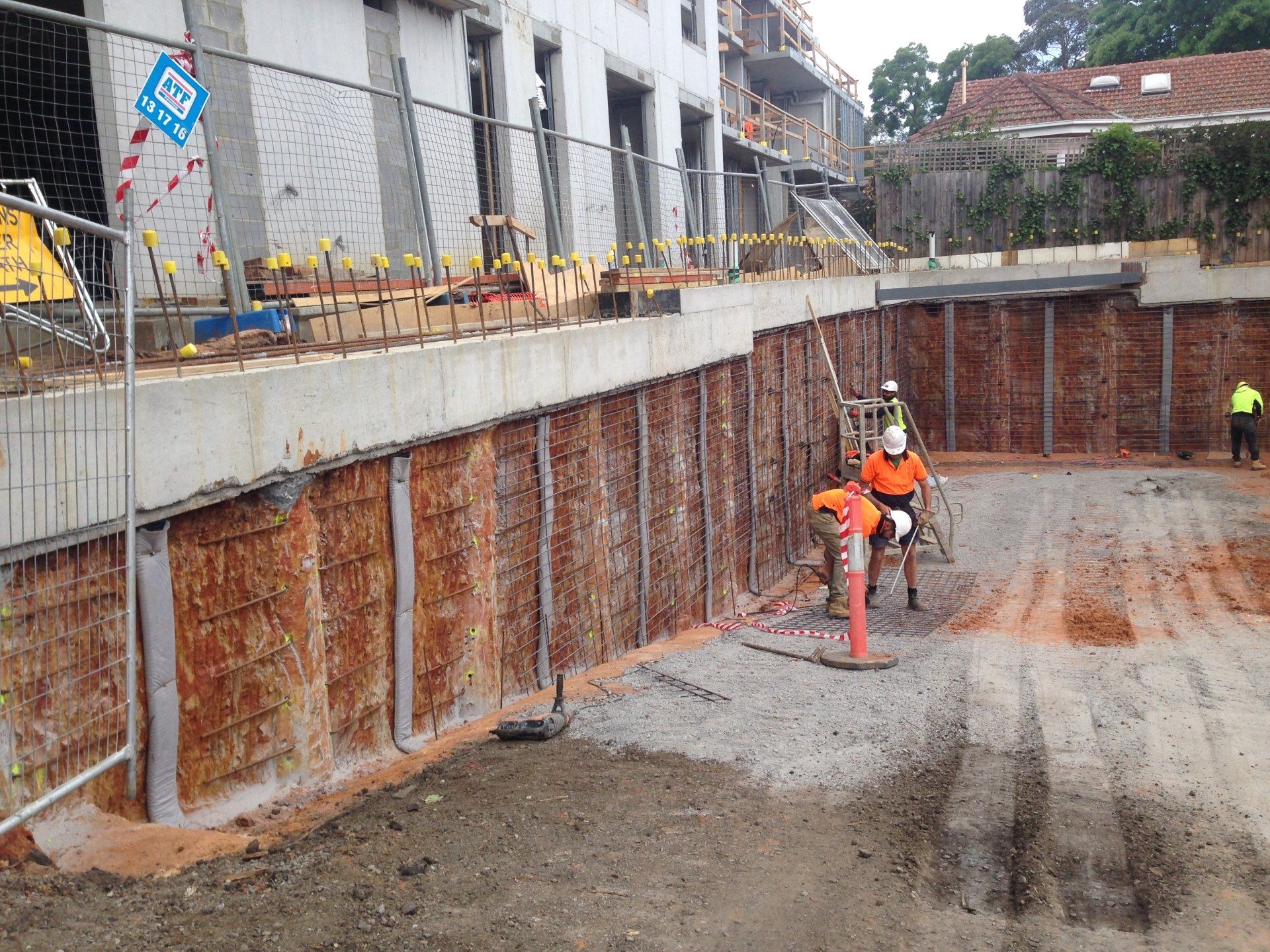 construction workers measuring steel bars