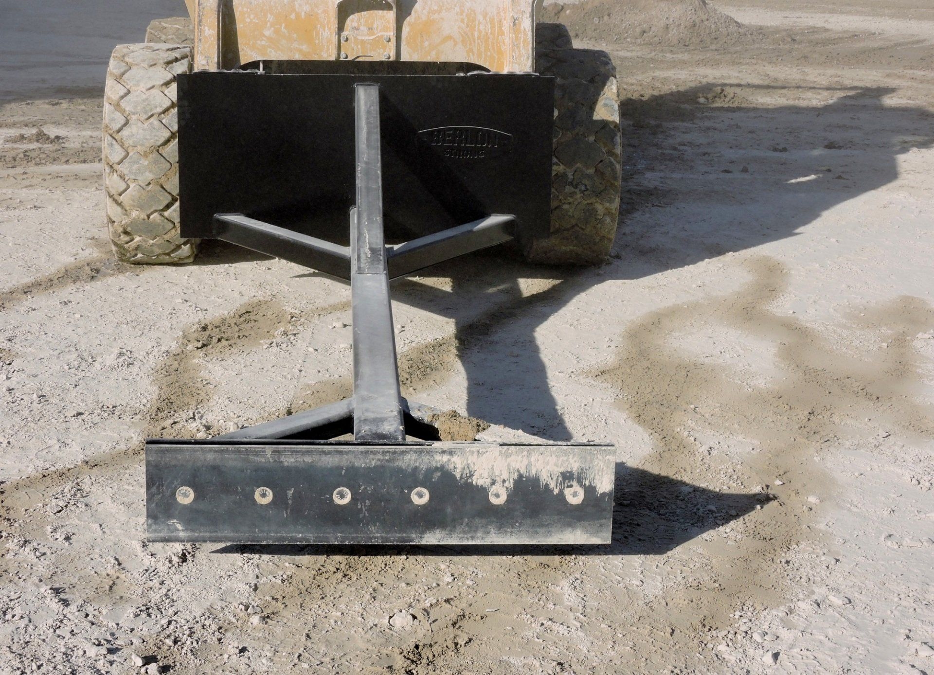 Skid Steer Attachment to Material Scraper Berlon Industries