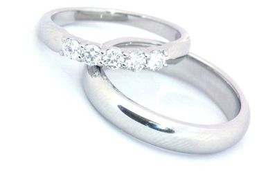 two wedding bands one with diamonds