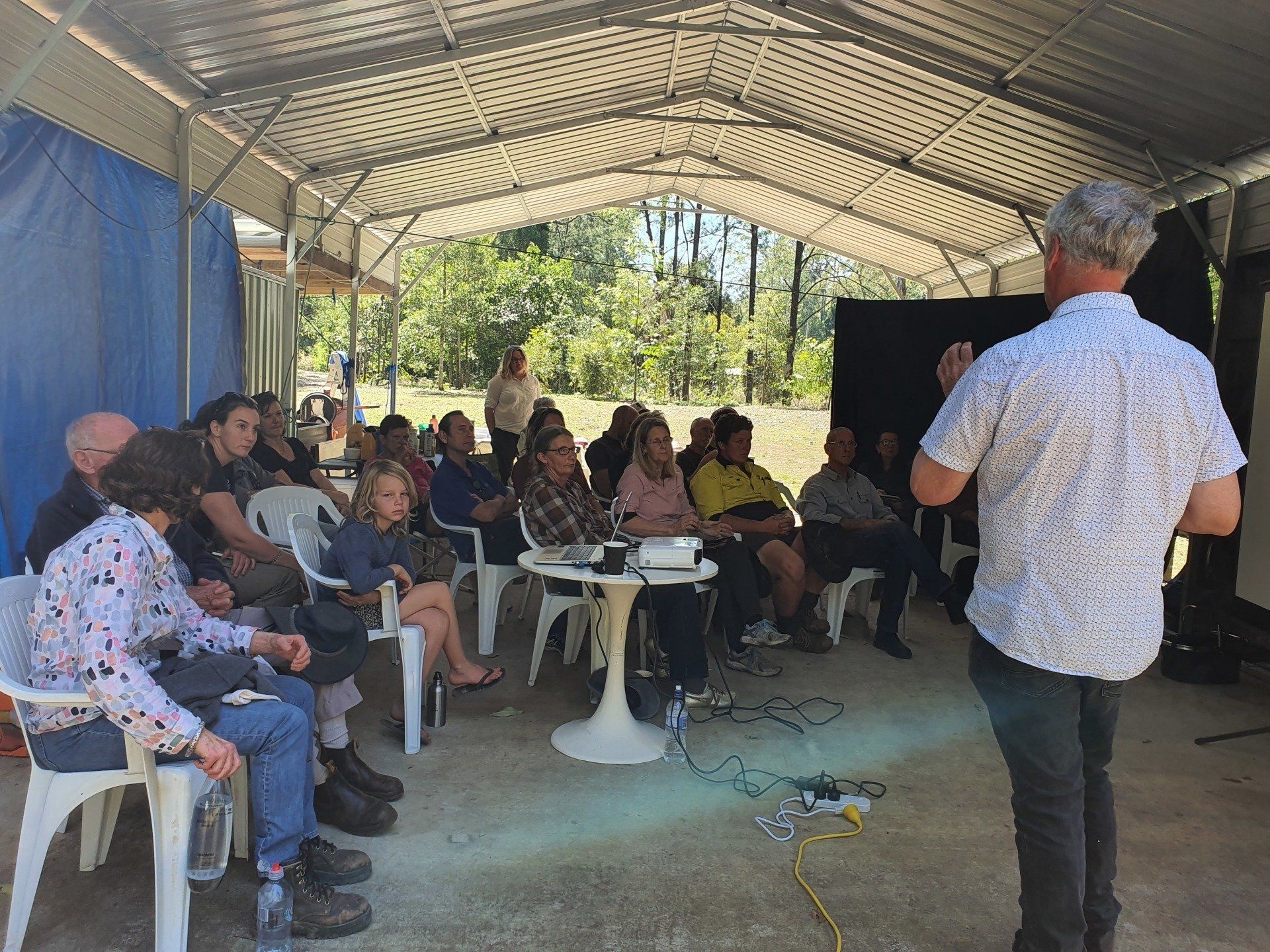 An eager audience listens to ecologist David Charley