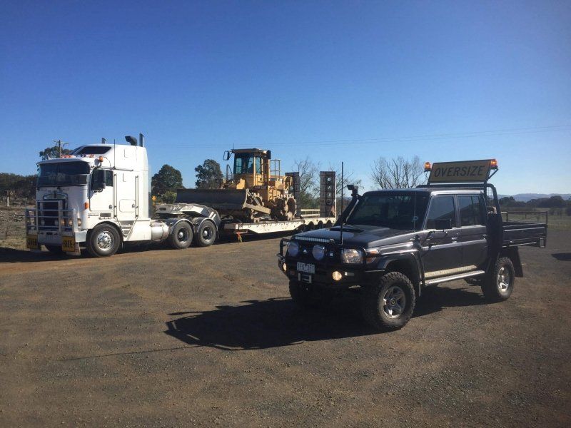 Machine being transported via road
