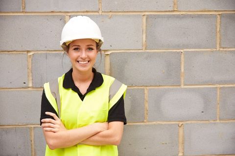 construction woman worker smiling