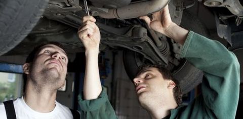 mechanic checking an exhaust system in Narre Warren