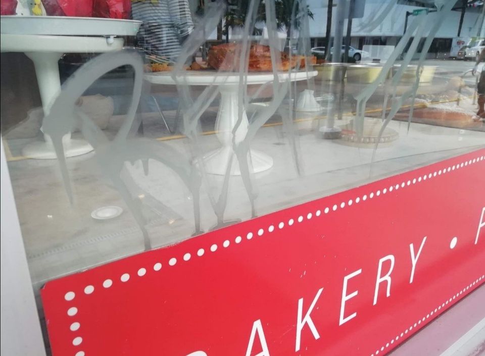 Graffiti on glass. How to remove acid etching graffiti on glass?