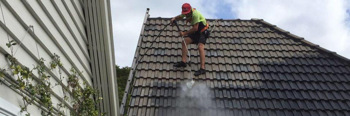 country wide roofing pty ltd specialist cleaning black roof with water
