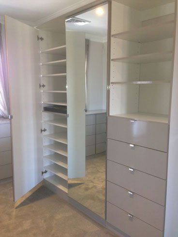 walk in wardrobe with gloss fronts