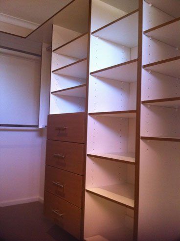 walk in wardrobe with coloured facia