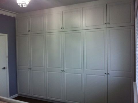 multiple white hinged door cubboards