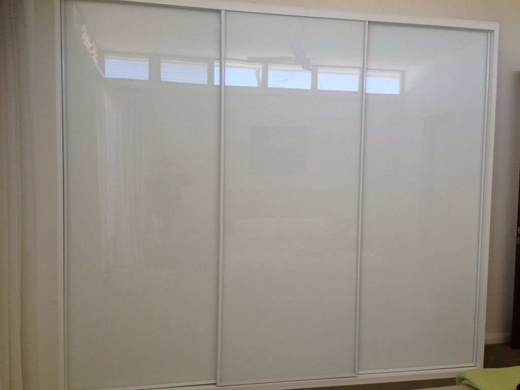 ultra white glass sliding wardrobe with white frame
