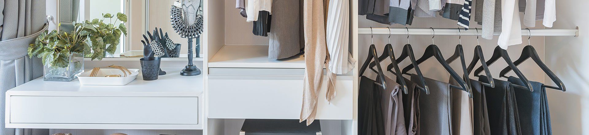 dress pants on hangers and mirror on the left