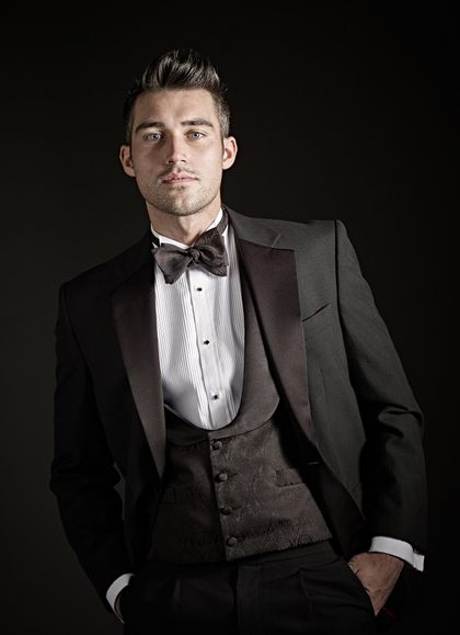 man wearing a black dress trousers with a black tie