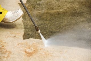 Pressure Washing — Concrete Floor Patio Using High Pressured Water Cleaner in Charleston, WV