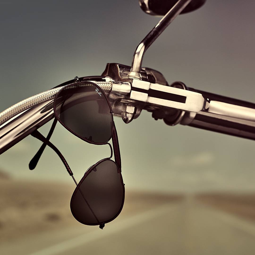 sunglasses hanging on handle bar