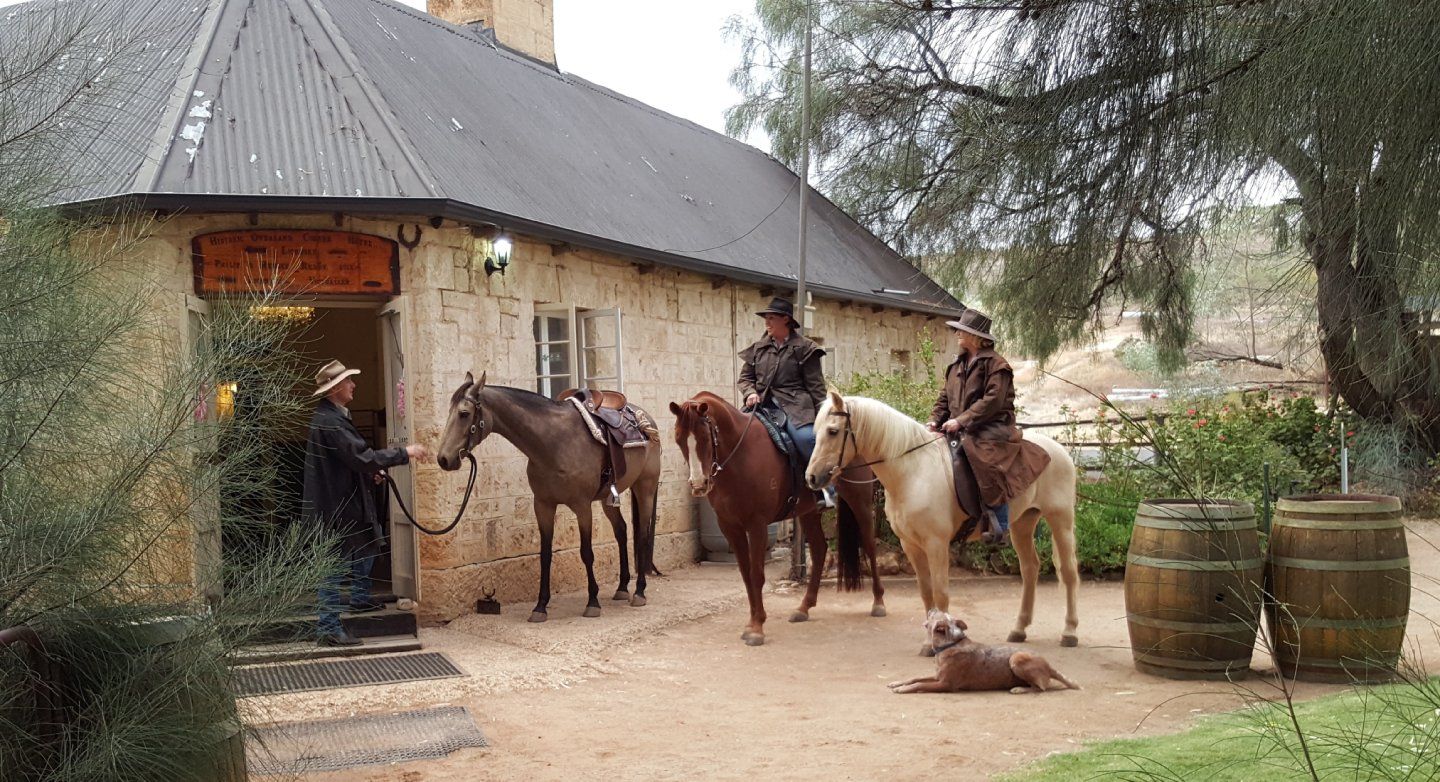 individuals horse riding at OC hotel