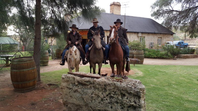 individuals horse riding at OC hotel