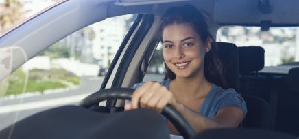 Satisfied woman with windscreen repair in Newcastle