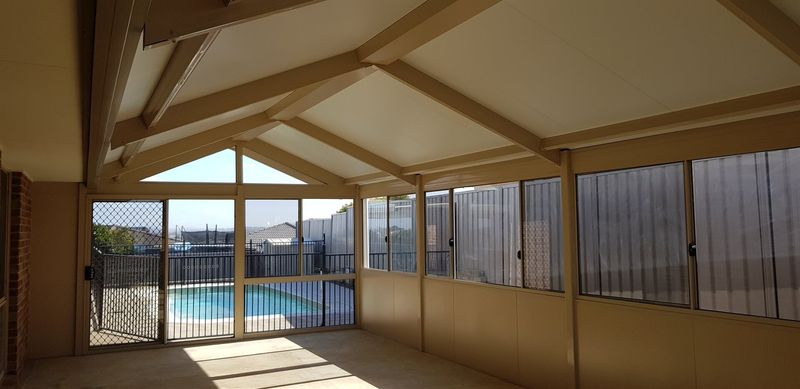 Glass Enclosure With Seats — Home Services in Thornton, NSW