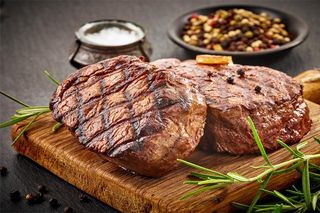 juicy steaks prepared on a grill