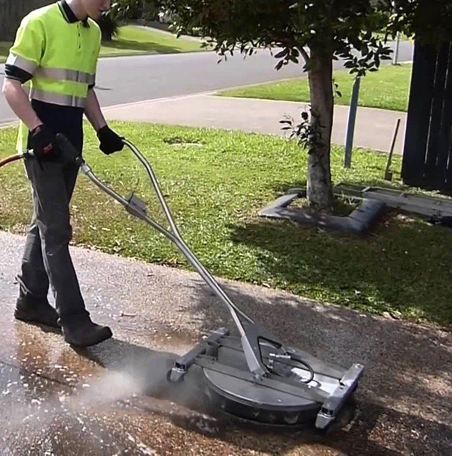 Driveway cleaning with a rotary-jet, pressure cleaning tool.
