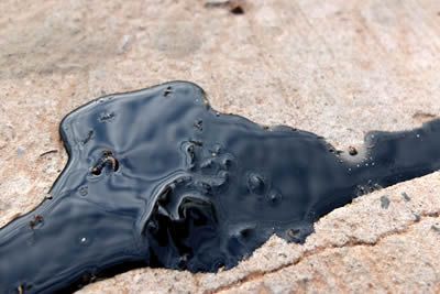 Oil stain removal as part of a professional driveway cleaning, paver cleaning or concrete cleaning project.