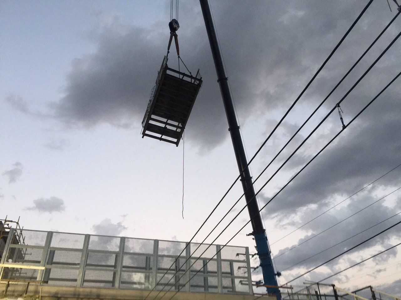 box hanging from crane