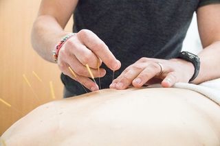 sticking needle in back