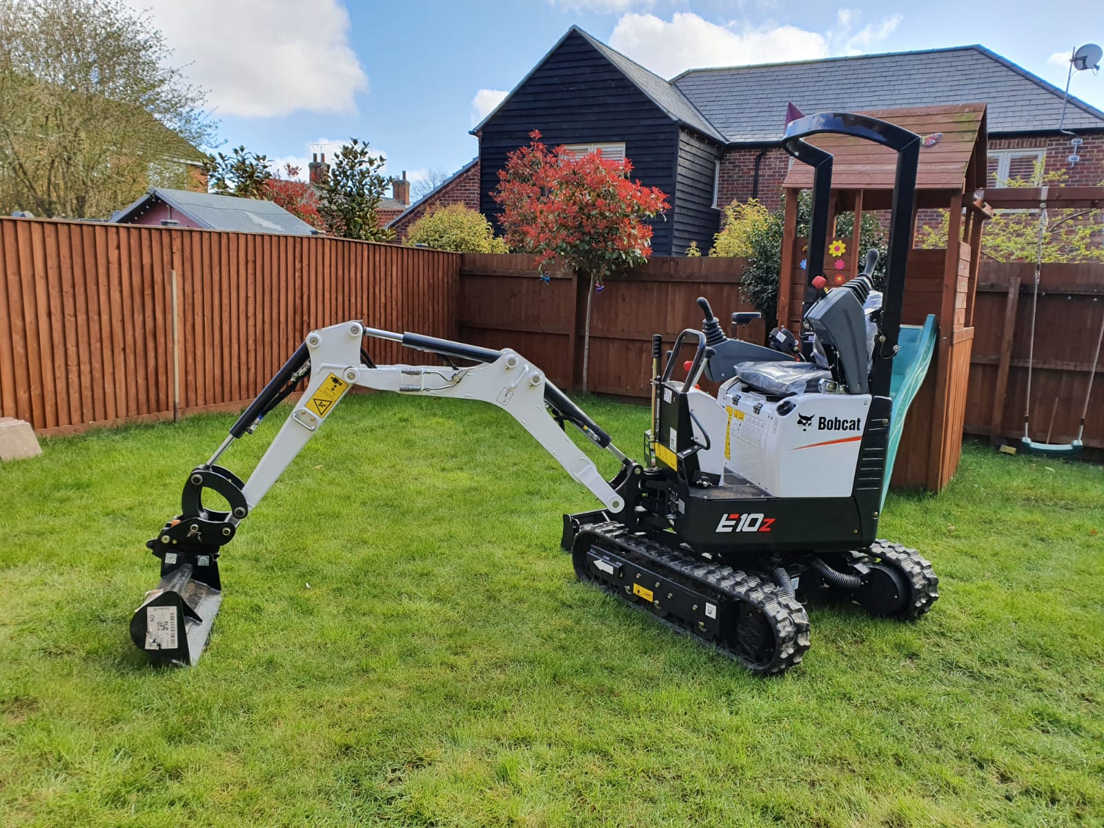 Man with digger hire Green Rooms