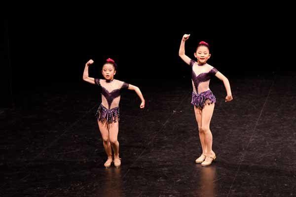 two dancers wearing purple