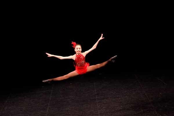 dancer wearing red jumping