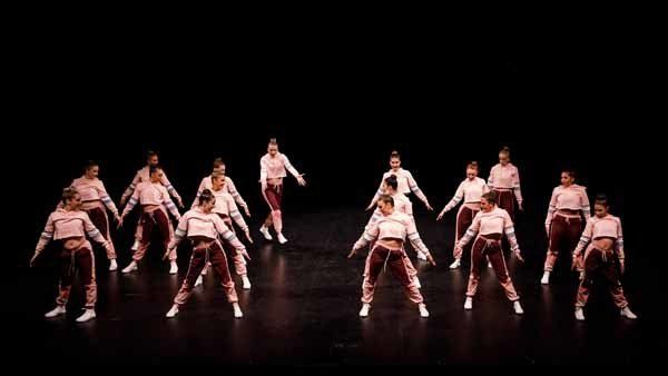 female dancers performing in pink