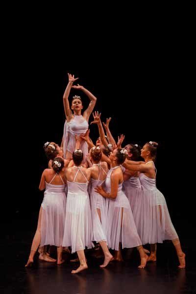 dancers lifting someone