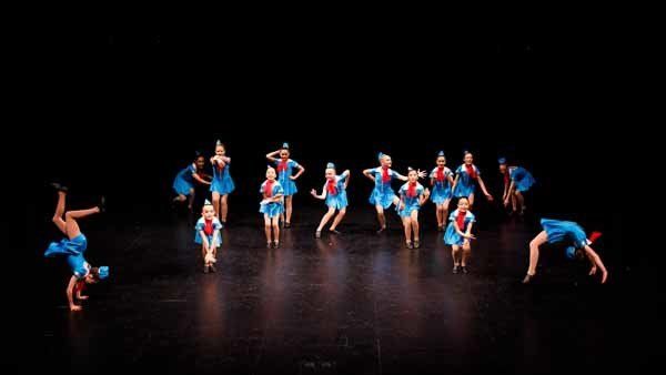 group of dancers in blue