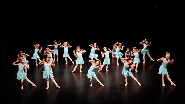 dancers in blue