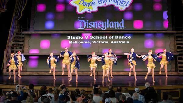 dancers in blue and gold on stage