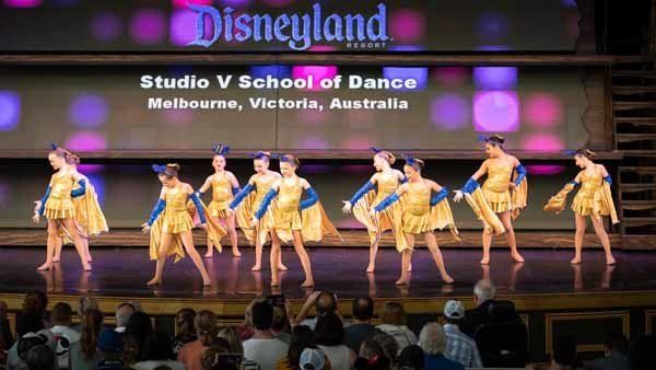 dancers in blue and gold