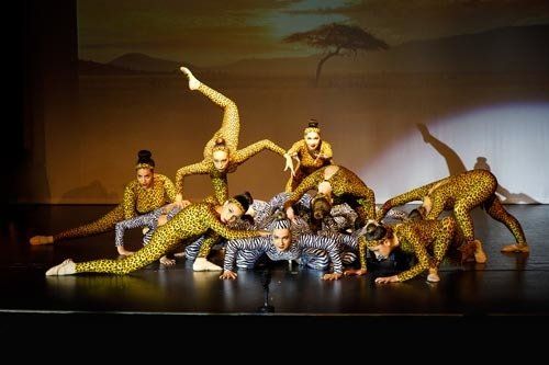 dancers in unique poses on stage