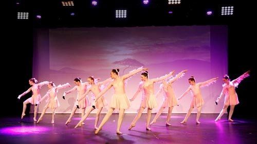 dancers in light pink costumes