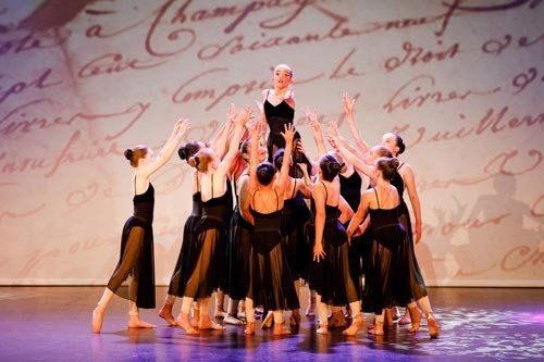 dancers lifting another dancer