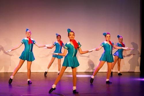 dancers in blue costumes