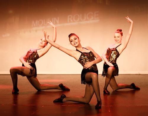 dancers in pose on stage