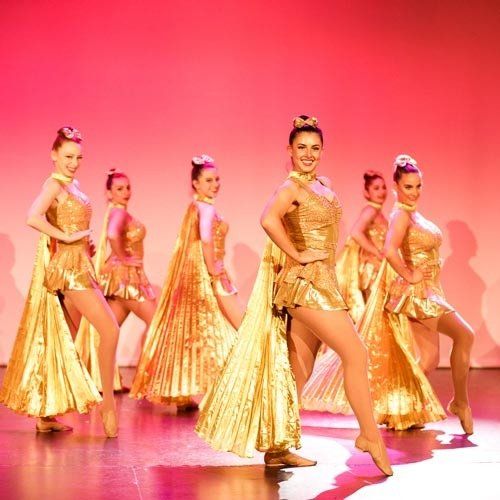 dancers in gold dress
