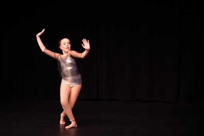 dancing girl in silver outfit