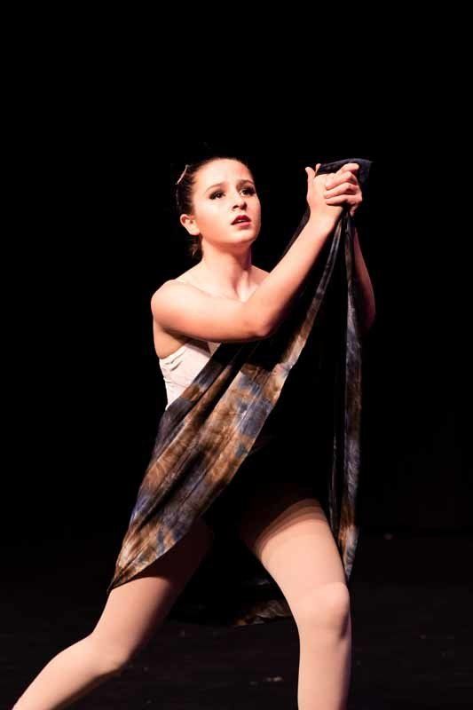 young woman performing in costume