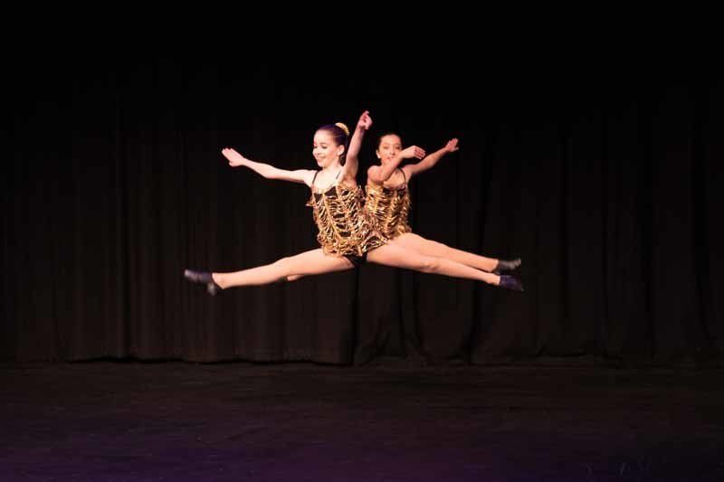 girl dancers leaping mid air