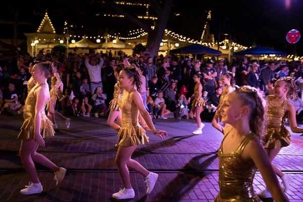 dancers during parade wearing gold