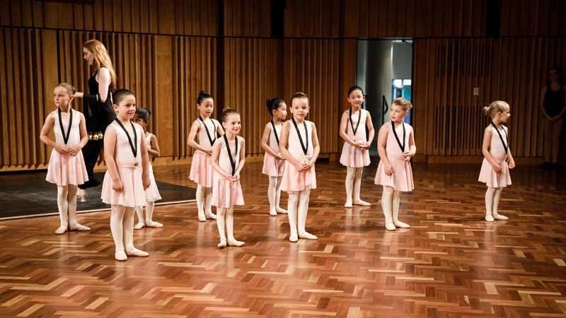 girls in pink standing in lines