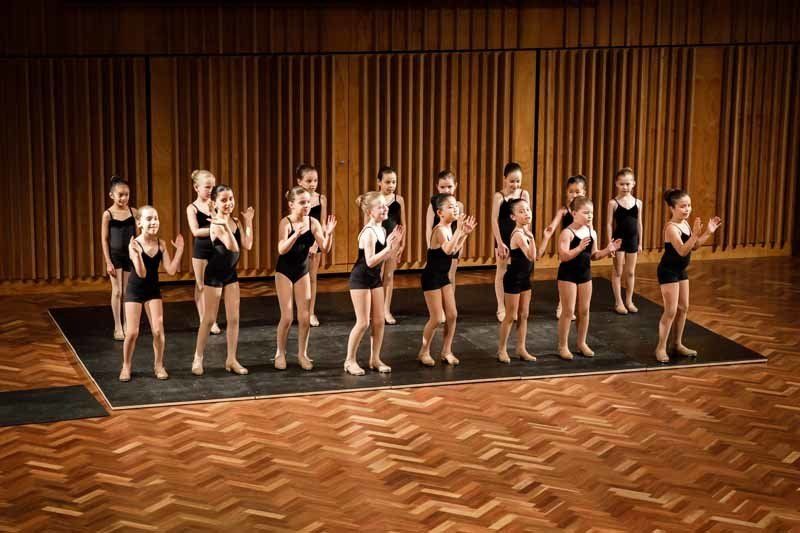 young dancers lined up to perform